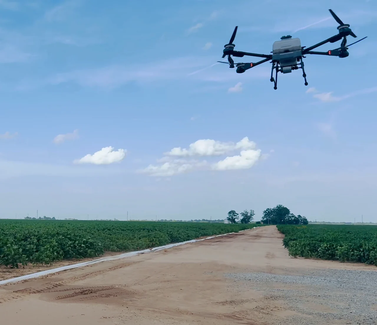 The Talos T60X flying toward the camera over agricultural fields